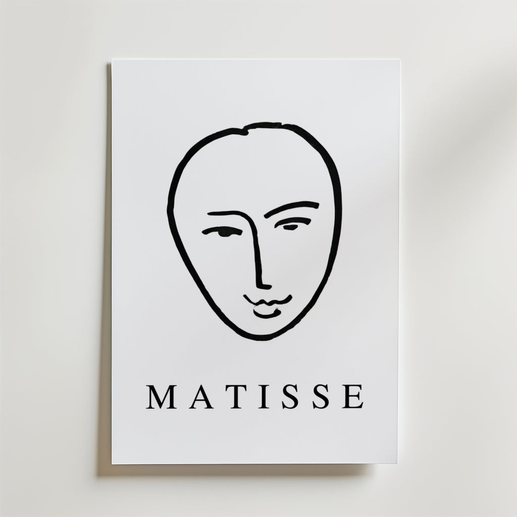 Minimal Matisse Poster by Bozetto har ett minimalistiskt svart linjeansikte på en vit bakgrund med fet "MATISSE" text, tryckt på premiumpapper med en matt finish för en elegant look.