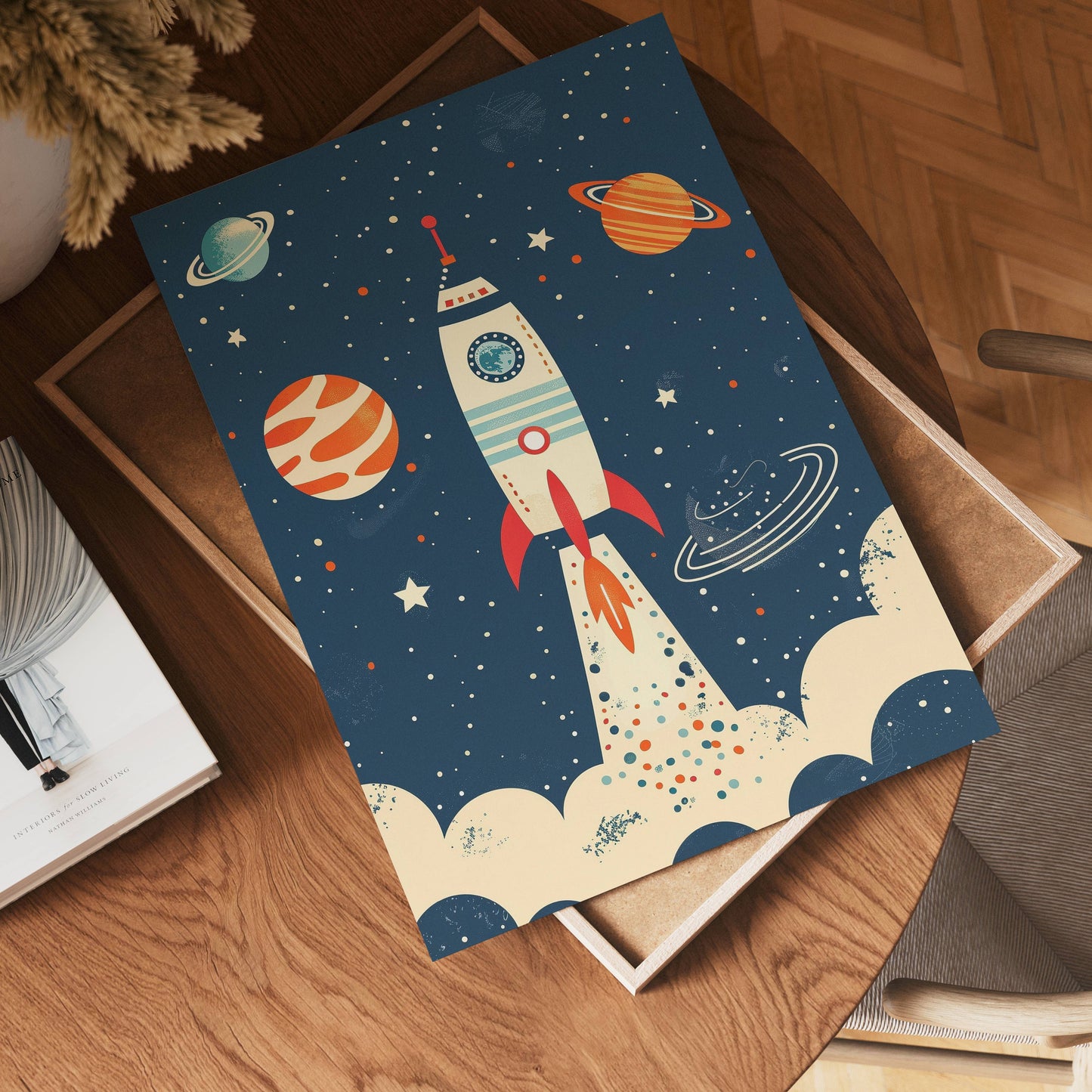 A vibrant illustration of no-9, a rocket ship soaring amid stars and planets, rests on a wooden table beside books and a chair.