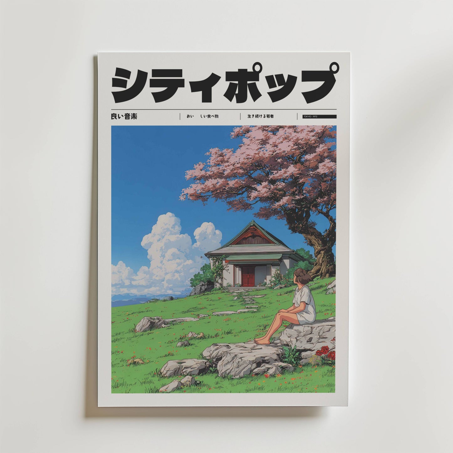 Soft Winds of April Poster" från Bozetto har japansk text och en illustration av en kvinna som sitter i gräset nära ett blommande körsbärsträd, med ett litet hus och en blå himmel med moln i bakgrunden.
