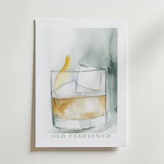Old Fashioned Drink Poster från Bozetto har en akvarellillustration av en Old Fashioned cocktail med apelsinskal och is, tryckt på FSC-certifierat premiumpapper -OLD FASHIONED står skrivet under glaset.