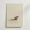 Ett fotografi av en enda utsmyckad porslinsskål med blommönster, placerad på en ljus yta, förkroppsligar minimal elegans - perfekt för hållbar inredning eller som Bozetto Vintage Ceramic Cup Poster på premiumpapper.