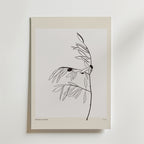 Olive Whisper Poster by Bozetto är en minimalistisk botanisk konstprint med en tunn svart stam, smala blad och två mörka cirklar på en vit bakgrund med en ljusbeige kant. "BOTANICA GALLERIE" är tryckt längst ner.